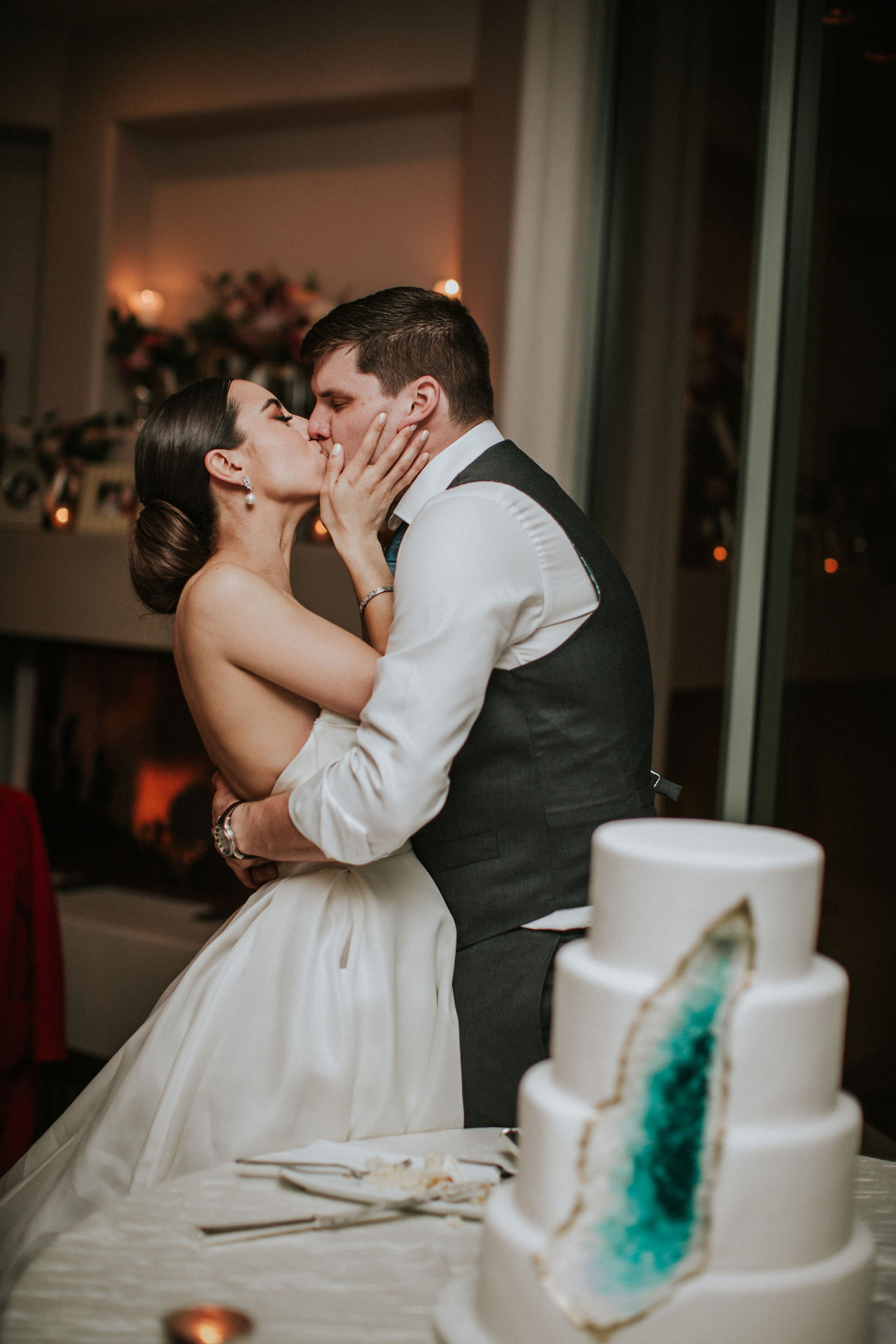 Sam and Austin sharing a kiss at their wedding reception