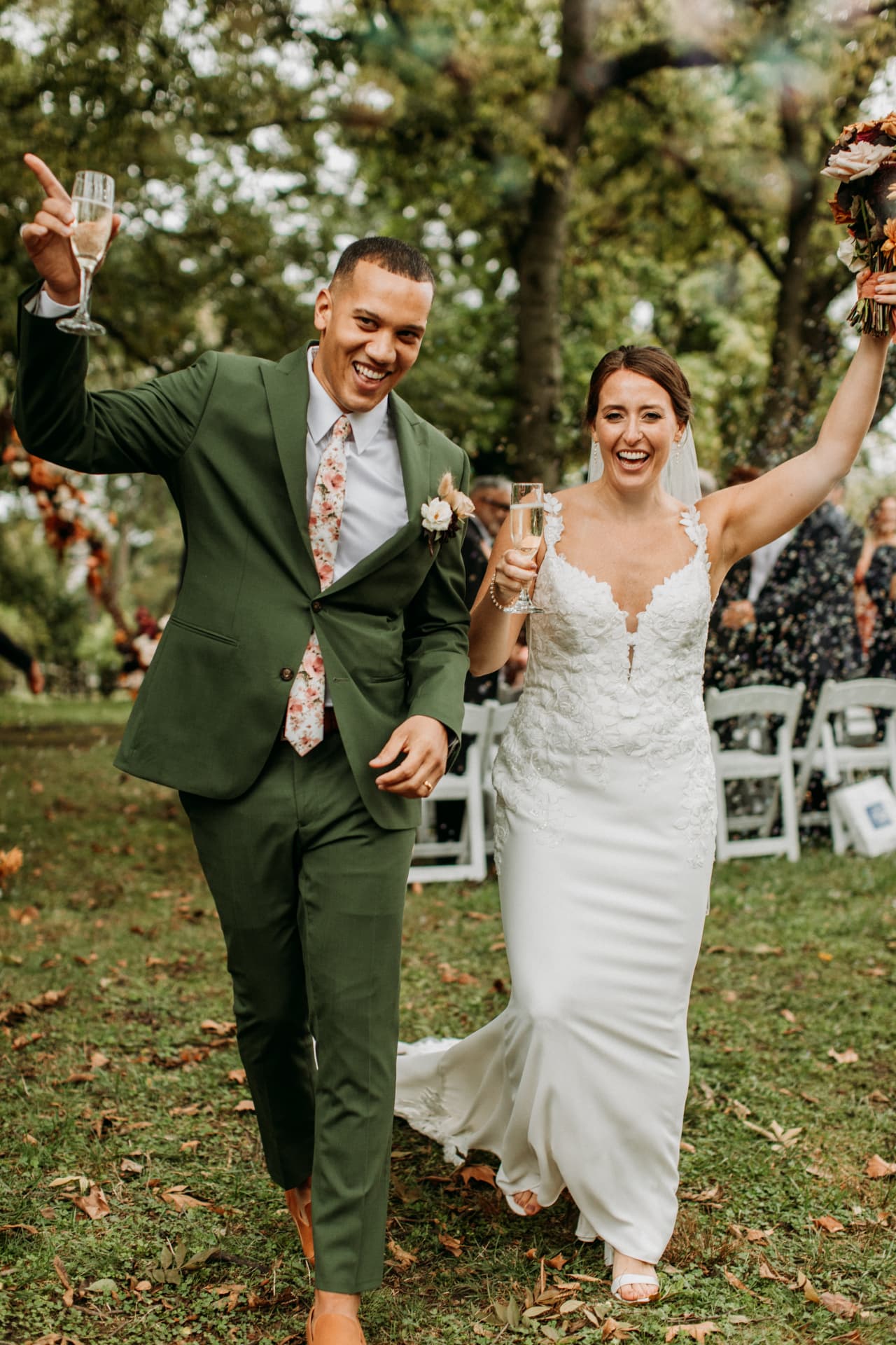 Bride and groom celebrating with champagne after their ceremony