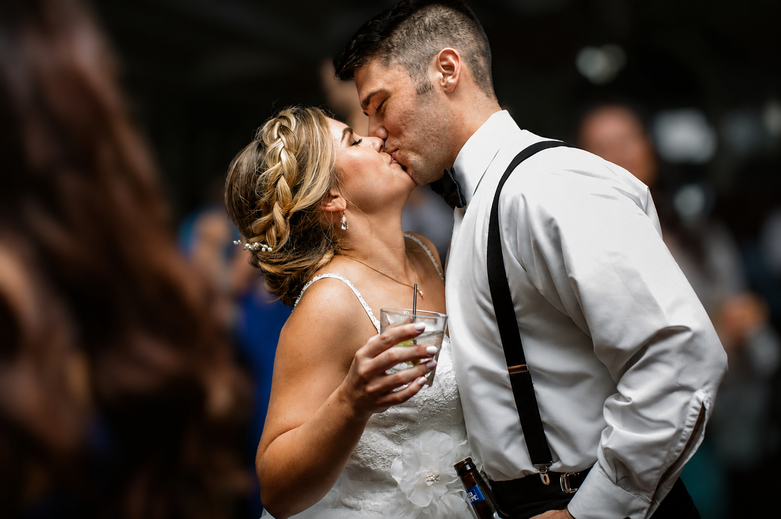 Bride and groom kissing on the reception dance floor